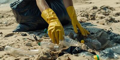 Problem of environmental pollution by plastic and recycling. Picking up plastic trash on beach. photo