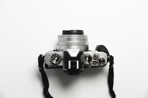 modern camera in retro style with a strap close-up, top view photo