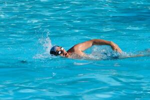 Swimming man in pool photo