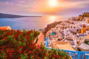 Sunset over Oia town on Santorini island in summer. Santorini, Greece photo