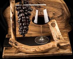wine grapes on olive wood photo