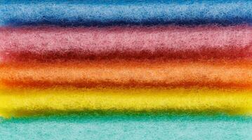Multi-colored cleaning sponge. Background made from multi-colored cleaning cloth. photo