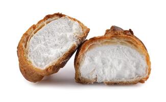 Porophytole cut in half with white cream isolated on a white background. Eclair with cream. photo
