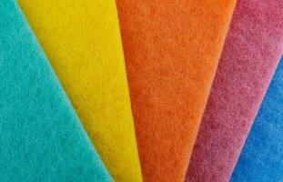 Multi-colored cleaning sponge. Background made from multi-colored cleaning cloth. photo