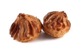 Two profiteroles isolated on a white background. Mini eclair on white. photo
