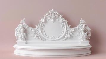 A highly intricate white baroque-style shelf adorned with decorative elements, set against a soft pink background. The shelf features detailed scrollwork and floral patterns. photo