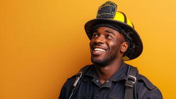 A black firefighter in uniform smiling against a vibrant orange background, showcasing positivity and strength. photo