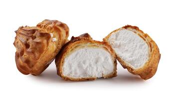 Cut in half and whole porophytole with white cream isolated on a white background. Eclair with cream. photo