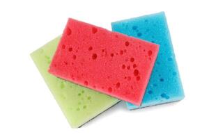 Several colored dishwashing sponges isolated on a white background. photo
