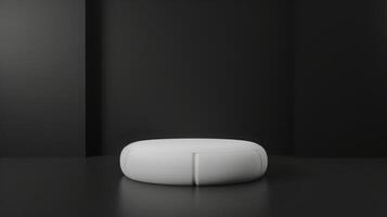 A white, circular piece of furniture sits in the center of a dark, minimalist room with black walls and floor, creating a striking contrast. photo