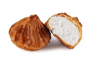 Profieroles with cream isolated on a white background. Whole and half profiteroles. photo