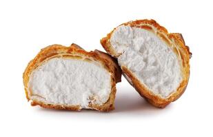 Porophytole cut in half with white cream isolated on a white background. Eclair with cream. photo