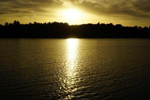Sunset over Galve lake - Trakai, Lithuania photo