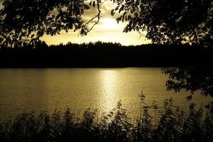 Sunset over Galve lake - Trakai, Lithuania photo