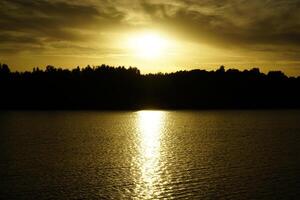 Sunset over Galve lake - Trakai, Lithuania photo