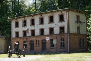 Gizycko, Poland - May 13th 2024 - Cannon and building at former Prussian Boyen Fortress photo