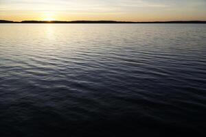 Sunset over lake - Masuria, Poland photo