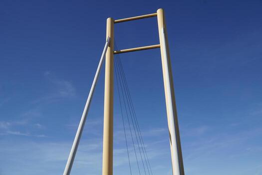Cable-stayed bridge and cloudless sky - view from below photo