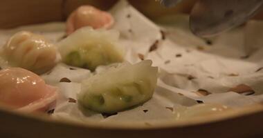 Banyo bot loc, Vietnamese dumplings with a chewy texture made with tapioca flour and filled with pork and shrimp. video