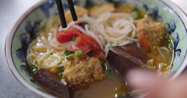 Vermicelli soup Hot and sour Thai soup cooked with shrimp or prawn, tom yum soup. dish in brown bowl with spoon. Ingredients and vegetables. Fragrant spices and herbs used in seafood broth video