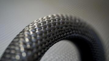 A close inspection of a rubber hoses end shows the precision molding of its curved edges and the strength of its thick walls photo