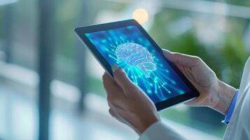 A hand holding a tablet with a brain health reminder app icon on the screen photo