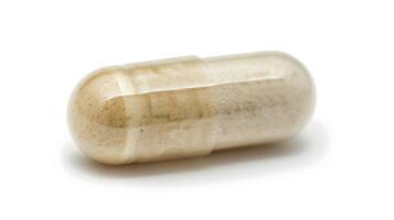 A closeup of a capsule filled with a potent blend of herbs and nutrients to enhance brain function and mental alertness photo