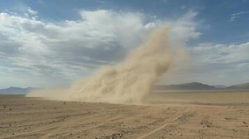 The peculiar almost ghostly appearance of a dusty whirlwind in the middle of an otherwise empty desert photo