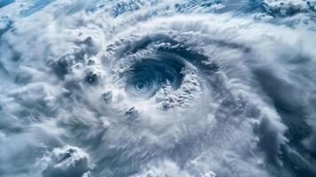 A closeup image of the clear calm eye of a hurricane contrasted against the chaotic clouds surrounding it photo