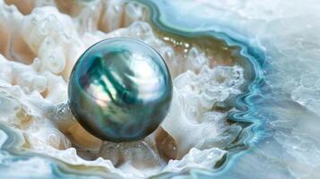 An unexpected burst of color in a sea of white as a cave pearl takes on a mesmerizing shade of blue or green photo
