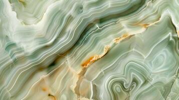 A smooth surface with intricate swirls of pale green hues resembling a polished jade stone photo