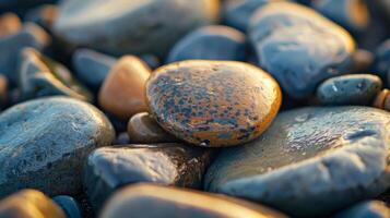 Small pebble with a velvety texture worn smooth by the gentle waves of the ocean photo