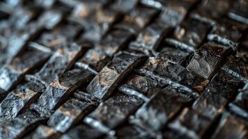 A macro shot of the crosssection of the conveyor belt revealing the intricate weblike pattern of fibers embedded within the rubber material photo