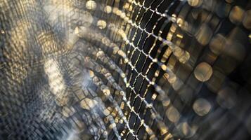 The gleaming surface of the mesh reflecting light and creating a mesmerizing gridlike pattern photo