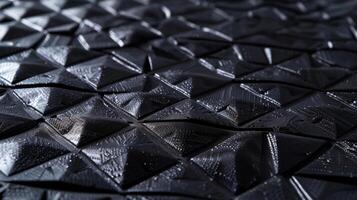 A of small triangular patterns repeating throughout the synthetic rubber providing a unique texture that enhances the materials ability to absorb shock and withstand tension photo