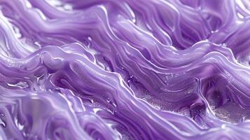 An extreme closeup of a purple silicone surface showcasing a unique pattern of swirls and waves giving it a rippled look photo
