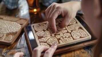 A person playing a handheld brain teaser game to keep their mind sharp photo