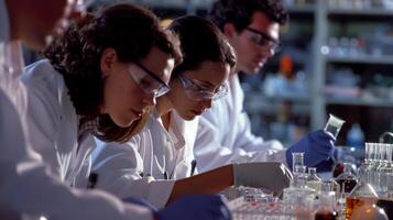 A group of researchers in lab coats studying the effects of genetics on the development of multiple sclerosis photo