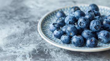 A plate of blueberries often referred to as a brain fruit due to their high levels of flavonoids and antioxidants that support cognitive function photo