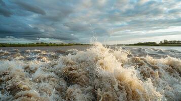 The serene river suddenly transforms into a wild ride as the tidal bore surges in leaving chaos in its wake photo
