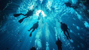 A group of scuba divers venturing into the eerie depths of a blue hole their bubbles creating a mesmerizing effect photo