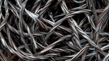 Delicately twisted steel wire strands caught in a thick layer of protective coating creating a mesmerizing texture photo