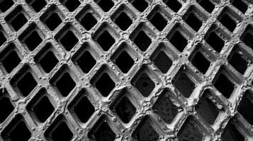 The intricate pattern of a large machines grating featuring sharp edges and a symmetrical layout for maximum support photo