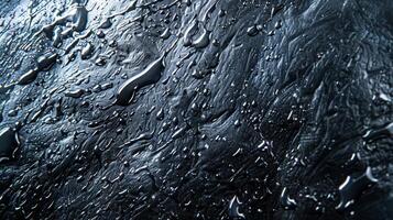A textured plastic with a shiny glaze appearing almost wet to the touch photo