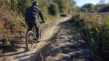 A bumpy and uneven bike path a challenge for riders due to the unstable ground beneath photo