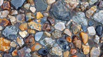 The varied and multicolored surface of a pebble with a unique mix of smooth shiny areas and rough weathered spots photo