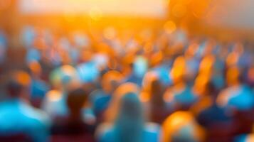 Fuzzy figures and a blurred backdrop at a packed public lecture photo
