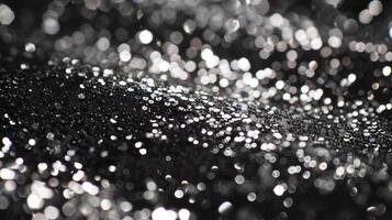 A shot of a supershiny silver sequin its surface resembling liquid metal as it reflects the light and dances with every movement photo