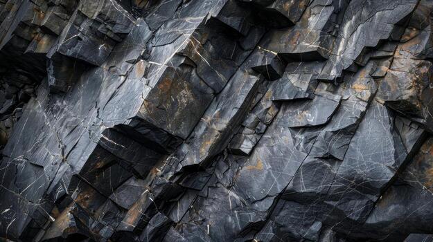 A closer look at this jagged rock face shows a complex network of sharp angular surfaces giving it a menacing and formidable appearance photo
