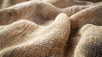 A diagonal view of a burlap fabric showcasing the distinct vertical lines and organic imperfections that give it a rustic charm photo